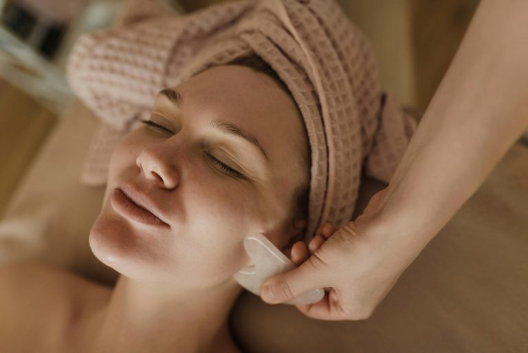 woman in facial treatment massage